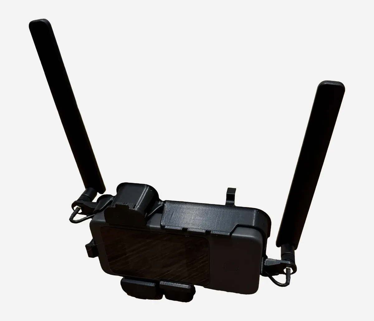 The streaming router in its 3D-printed holder with two antennas raised